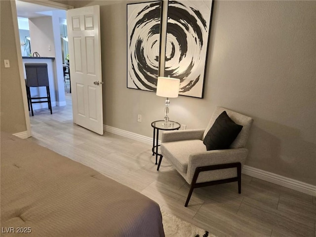 bedroom with wood finished floors and baseboards
