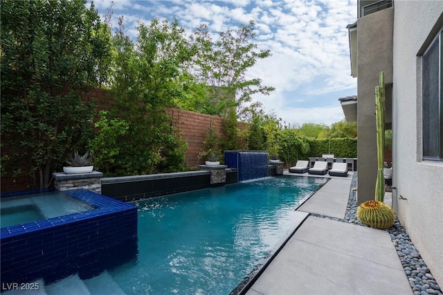 view of swimming pool featuring a fenced in pool, a patio, a fenced backyard, and an in ground hot tub