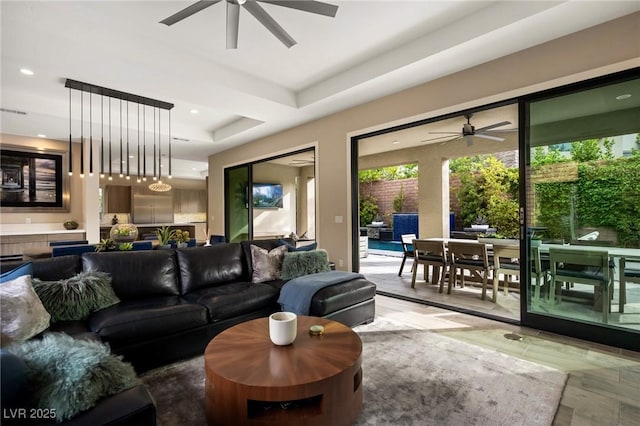 living room featuring recessed lighting and a ceiling fan