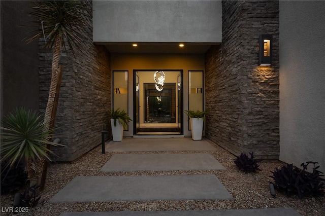 doorway to property with stucco siding