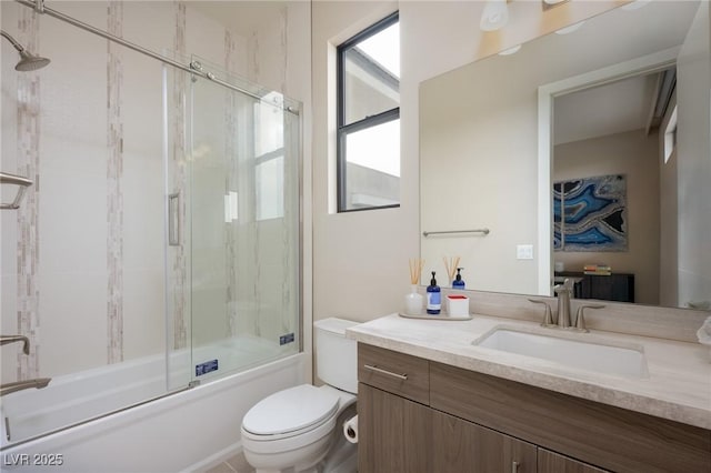 bathroom featuring shower / bath combination with glass door, toilet, and vanity
