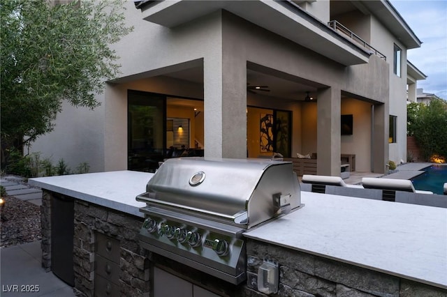 view of patio / terrace featuring grilling area, an outdoor pool, and area for grilling