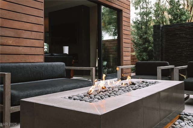 view of patio / terrace with a fire pit
