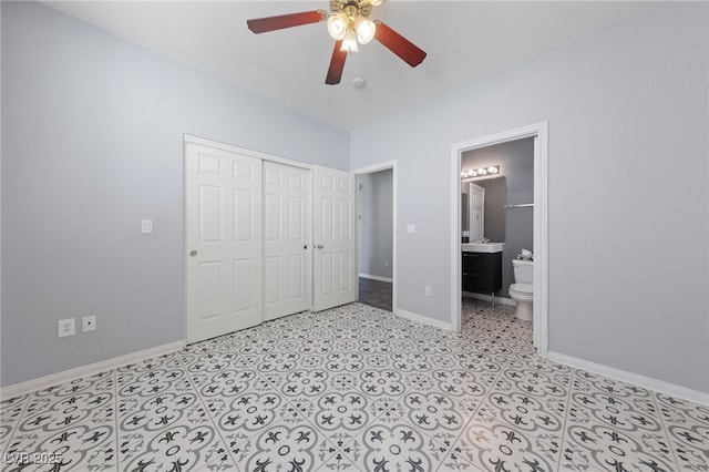 7589 Grassy Bank St, Las Vegas, NV 89139 - unfurnished bedroom with baseboards, a closet, ensuite bath, and a ceiling fan