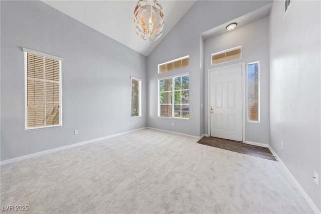 7589 Grassy Bank St, Las Vegas, NV 89139 - carpeted foyer entrance with a chandelier, high vaulted ceiling, and baseboards