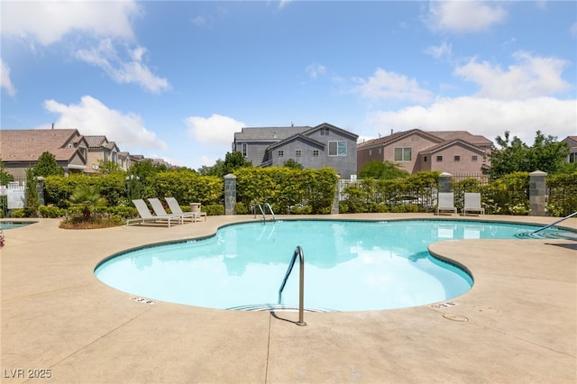 7589 Grassy Bank St, Las Vegas, NV 89139 - community pool with a patio, fence, and a residential view
