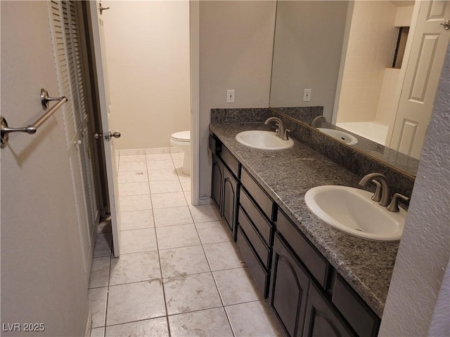 3621 Laguna Verde Way, Las Vegas, NV 89121 - bathroom featuring toilet, tile patterned floors, and a sink