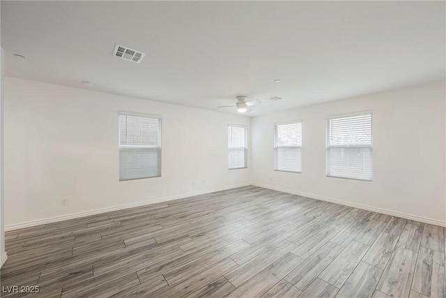 376 Yellow Finch Ln, Henderson, NV 89012 - empty room with wood finished floors, ceiling fan, and baseboards