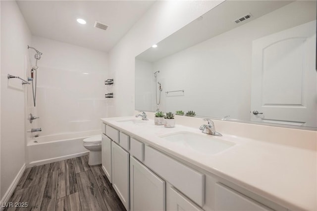 376 Yellow Finch Ln, Henderson, NV 89012 - bathroom featuring toilet, double vanity, shower / tub combination, wood finished floors, and recessed lighting