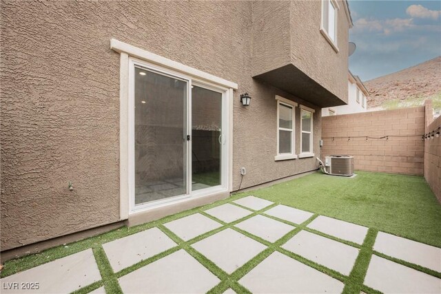 376 Yellow Finch Ln, Henderson, NV 89012 - fenced backyard with cooling unit and a patio area