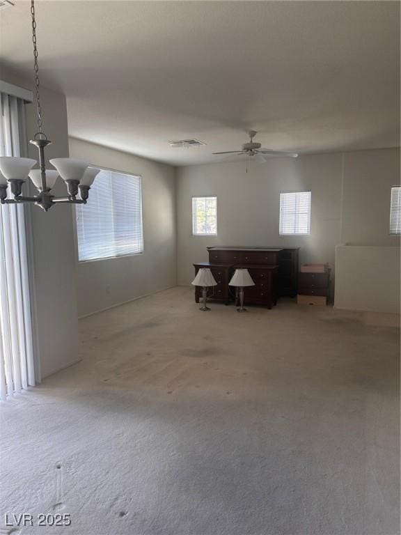 interior space with ceiling fan and visible vents