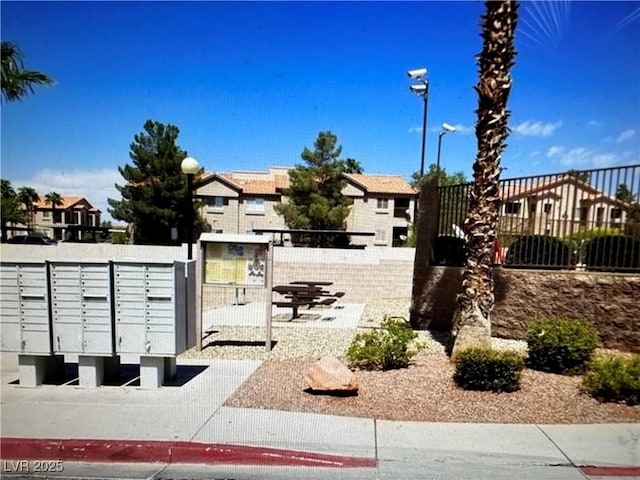 view of home's community featuring mail area