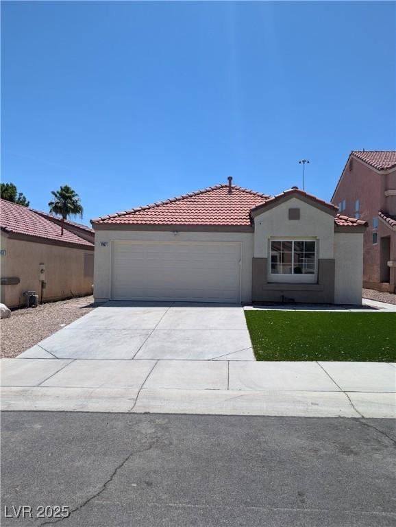 7957 Lovely Pine Pl, Las Vegas, NV 89143 - mediterranean / spanish-style home with stucco siding, concrete driveway, a tile roof, and an attached garage