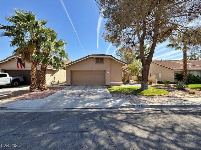 2022 Big Bend Way, Henderson, NV 89074 - view of front of house featuring stucco siding, driveway, and an attached garage