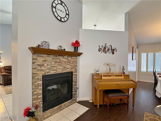 2022 Big Bend Way, Henderson, NV 89074 - living area with wood finished floors, vaulted ceiling, and a brick fireplace