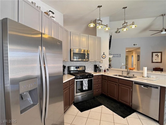 2022 Big Bend Way, Henderson, NV 89074 - kitchen with appliances with stainless steel finishes, light countertops, light tile patterned flooring, backsplash, and lofted ceiling