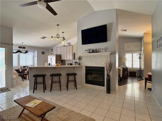 2022 Big Bend Way, Henderson, NV 89074 - living room with lofted ceiling, plenty of natural light, light tile patterned floors, and ceiling fan