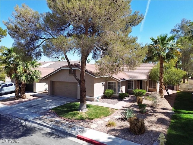 2022 Big Bend Way, Henderson, NV 89074 - ranch-style house with a tiled roof, a garage, stucco siding, and concrete driveway