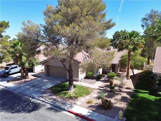 2022 Big Bend Way, Henderson, NV 89074 - obstructed view of property with stucco siding, a tile roof, an attached garage, and driveway