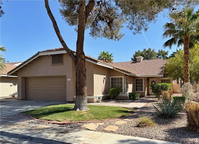 2022 Big Bend Way, Henderson, NV 89074 - single story home with a tile roof, stucco siding, driveway, a garage, and a front lawn