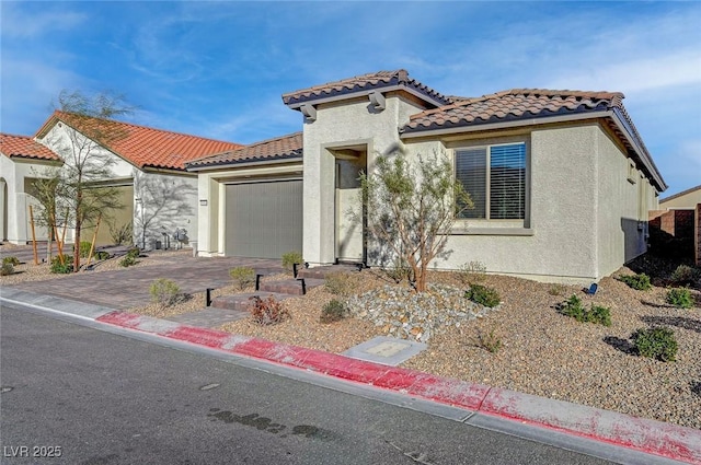 6544 Sandero Springs St, Las Vegas, NV 89166 - mediterranean / spanish-style home featuring stucco siding, driveway, a tiled roof, and a garage