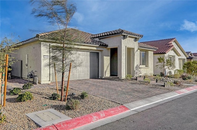 6544 Sandero Springs St, Las Vegas, NV 89166 - view of front of house with a garage, a tile roof, stucco siding, and driveway