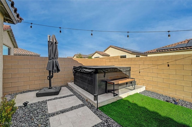 6544 Sandero Springs St, Las Vegas, NV 89166 - view of patio / terrace with a fenced backyard and a hot tub