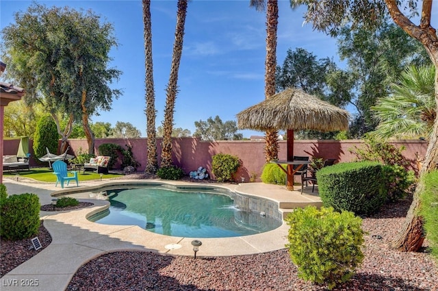 view of swimming pool with a fenced backyard, a patio, and a fenced in pool
