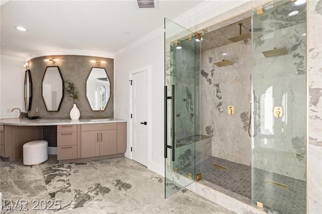 bathroom featuring marble finish floor, visible vents, a marble finish shower, ornamental molding, and a sink