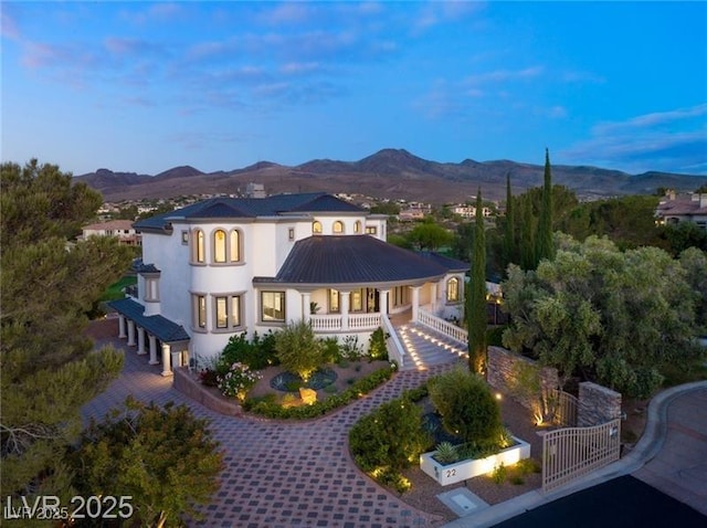exterior space featuring stucco siding and a mountain view