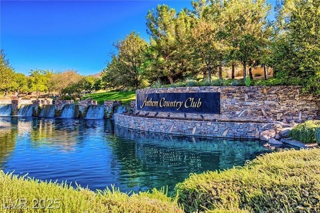 community sign with a water view