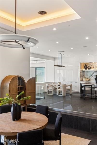dining area featuring a tray ceiling