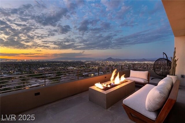exterior space with an outdoor living space with a fire pit and a mountain view