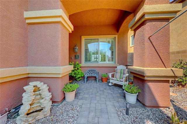 2733 Auchmull St, Henderson, NV 89044 - view of exterior entry featuring stucco siding and a patio area