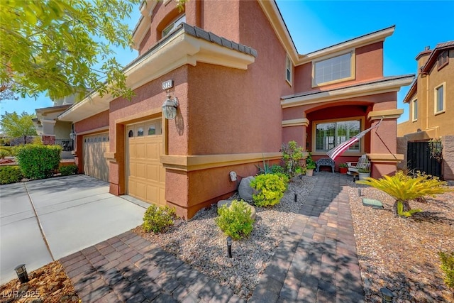 2733 Auchmull St, Henderson, NV 89044 - view of front of property featuring concrete driveway, stucco siding, and a garage