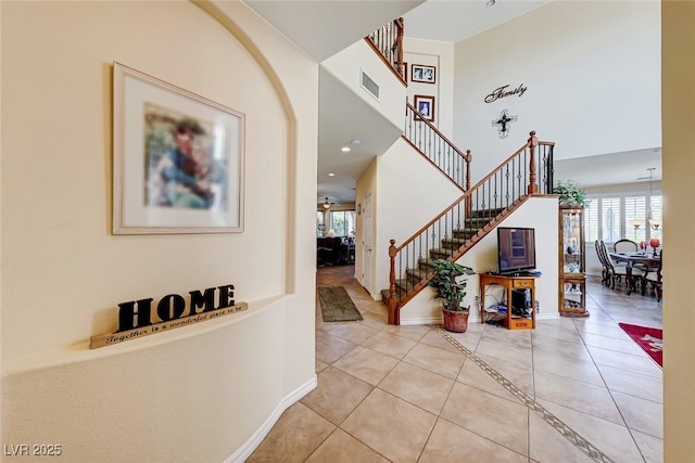 2733 Auchmull St, Henderson, NV 89044 - entrance foyer with tile patterned flooring, stairway, and a towering ceiling