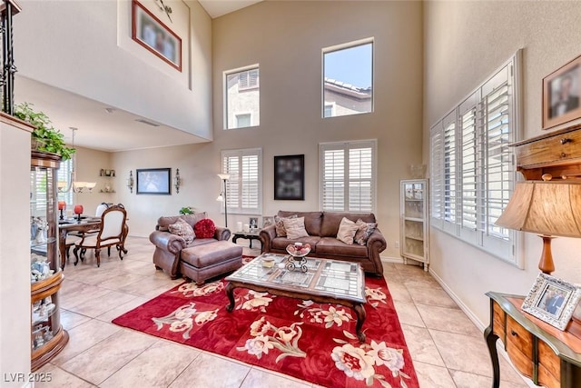 2733 Auchmull St, Henderson, NV 89044 - tiled living room with healthy amount of natural light and a towering ceiling