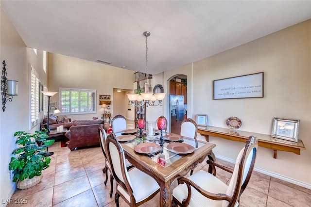 2733 Auchmull St, Henderson, NV 89044 - dining space featuring arched walkways and light tile patterned floors