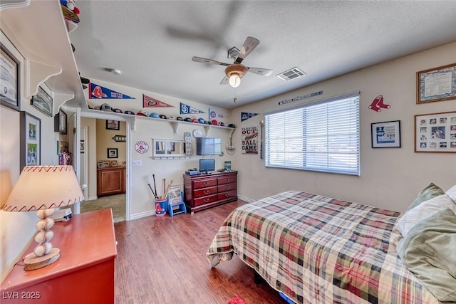 2733 Auchmull St, Henderson, NV 89044 - bedroom featuring wood finished floors, a textured ceiling, and ceiling fan
