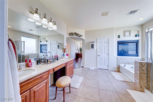 2733 Auchmull St, Henderson, NV 89044 - full bathroom featuring tile patterned floors, a bath, double vanity, and healthy amount of natural light