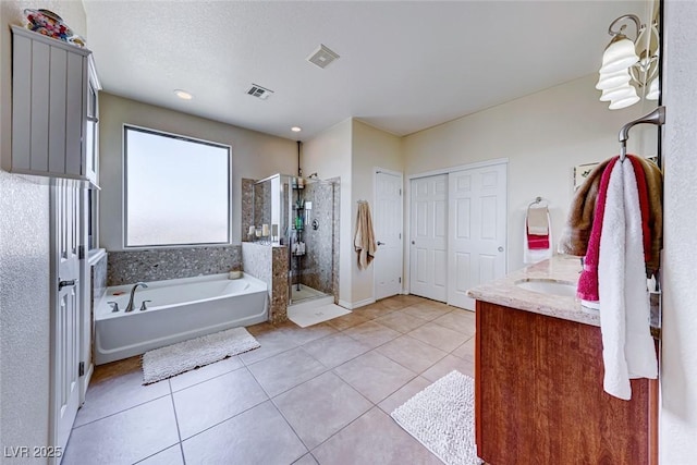 2733 Auchmull St, Henderson, NV 89044 - full bath featuring a garden tub, a stall shower, tile patterned flooring, and vanity