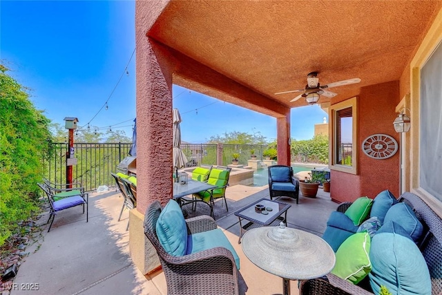 2733 Auchmull St, Henderson, NV 89044 - fenced backyard with an outdoor living space, a ceiling fan, and a patio area