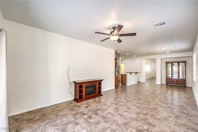 unfurnished living room with a ceiling fan, visible vents, and recessed lighting