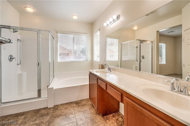 bathroom with a garden tub, a sink, and a stall shower