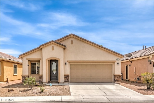 view of front of property with stucco siding, an attached garage, stone siding, and concrete driveway