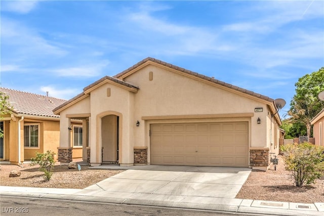 view of front of house featuring a tiled roof, driveway, stone siding, a garage, and stucco siding