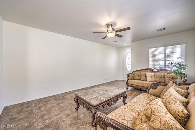 living room featuring baseboards, a ceiling fan, and visible vents