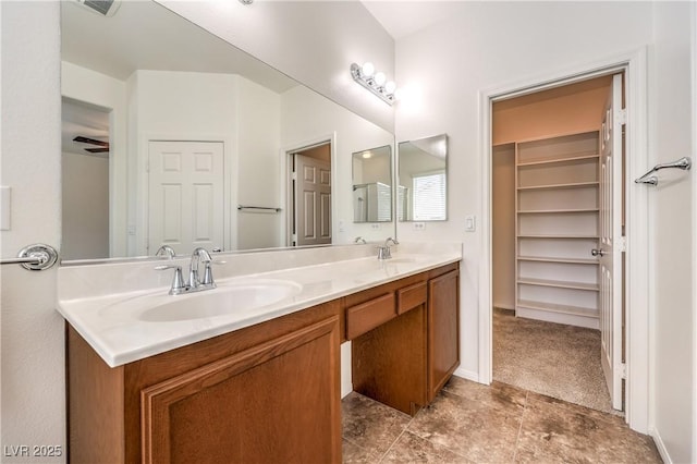 bathroom with a sink and double vanity