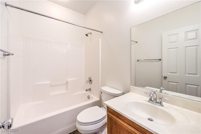 bathroom featuring shower / washtub combination, vanity, and toilet