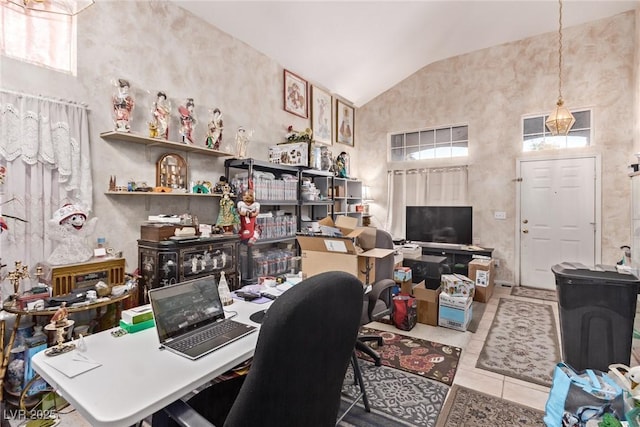 office area featuring vaulted ceiling and tile patterned flooring